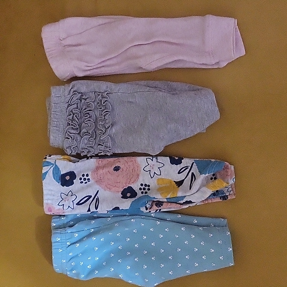 Four pairs of Carter's Newborn girls pants